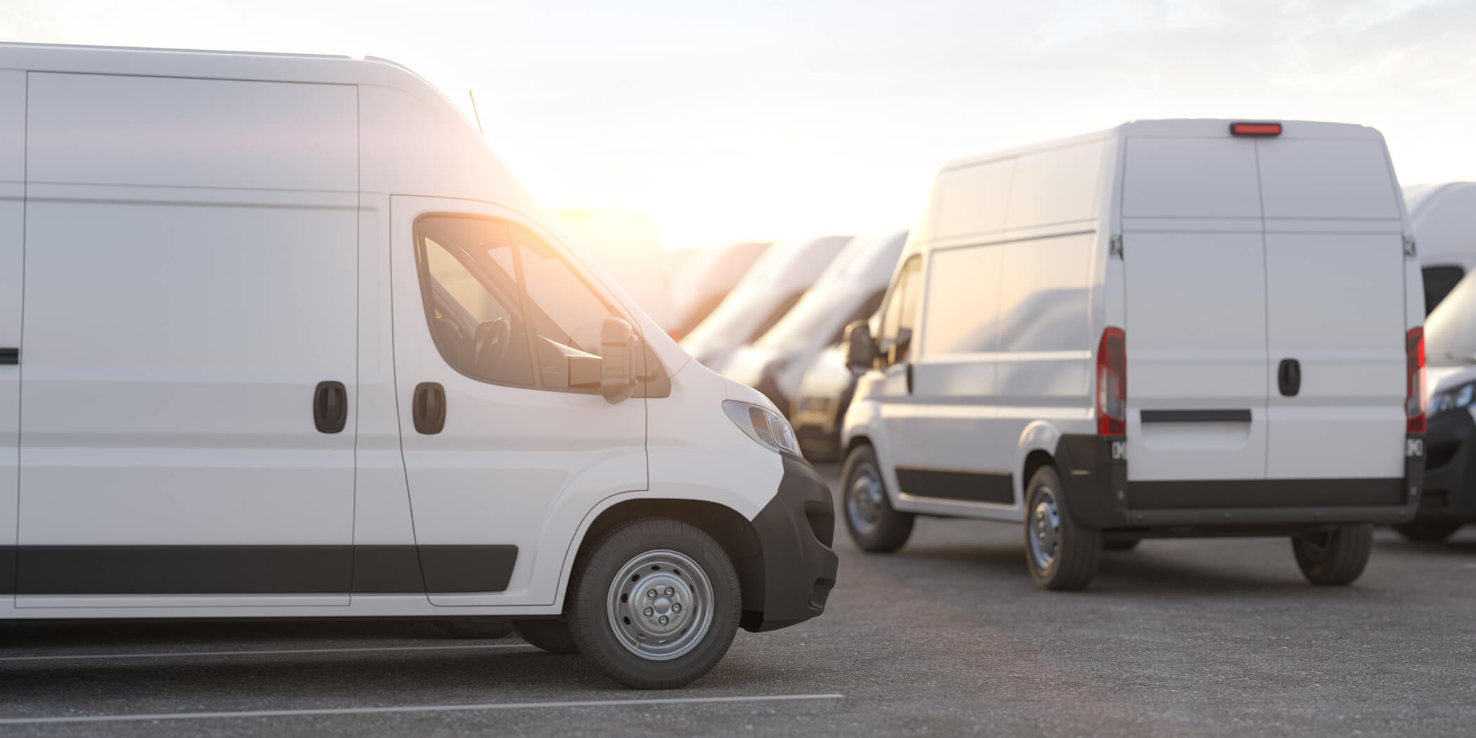 A fleet of vans parked in a car park
