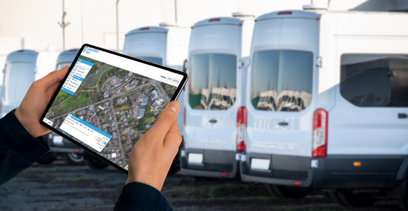 Man holding an iPad with Guardian Bell interface